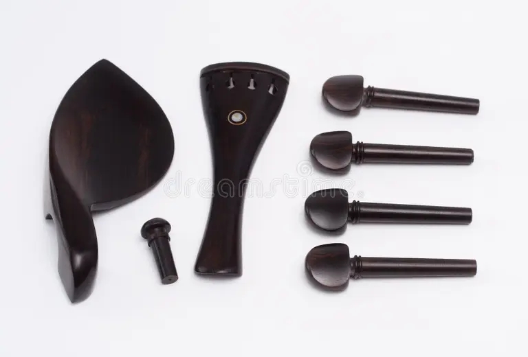 Эбони set ebony violin parts including pegs chin rest tail piece end button white background one set ebony violin parts 209857478 - Эбони